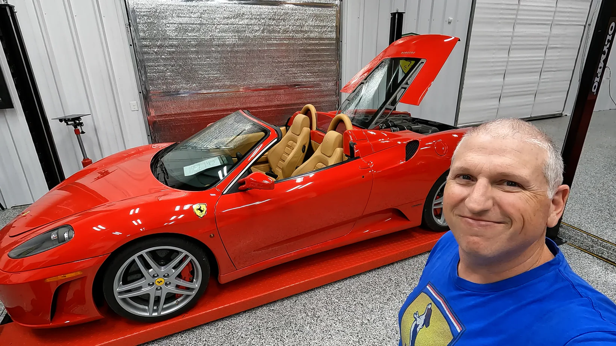 YouTube personality, Normal Guy Supercar, next to a red Ferrari